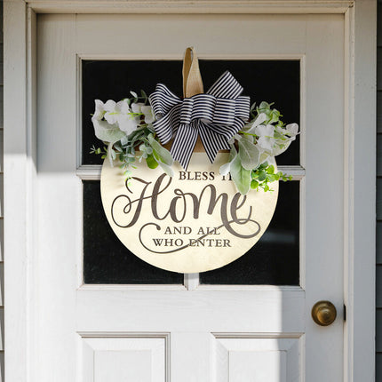 Rustic Wooden Door Hanger – "Bless This Home and All Who Enter" Round Sign with Artificial Flowers & Striped Bow for Front Door, Porch, or Entryway Decor.