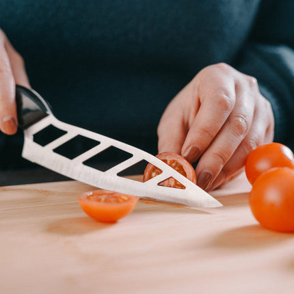 The Versatile Wonder Knife Chef Knife Standless Stell Blade Stay Smooth & Sharp.